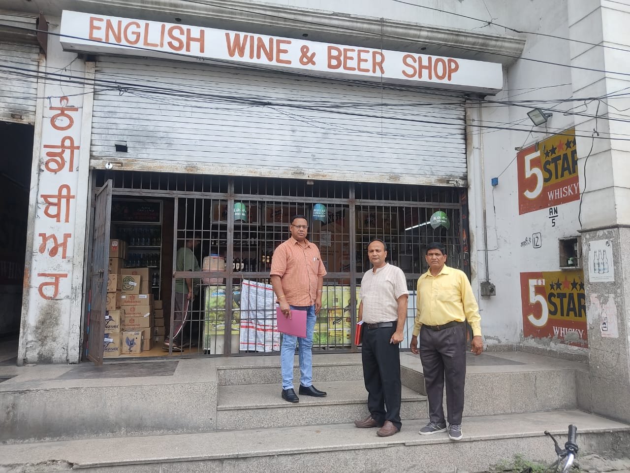  Dr Sukhwinder Singh DHO Jalandhar with food safety officers Mukul Gill and Rashu Mahajan raided wine shops at Basti nau
