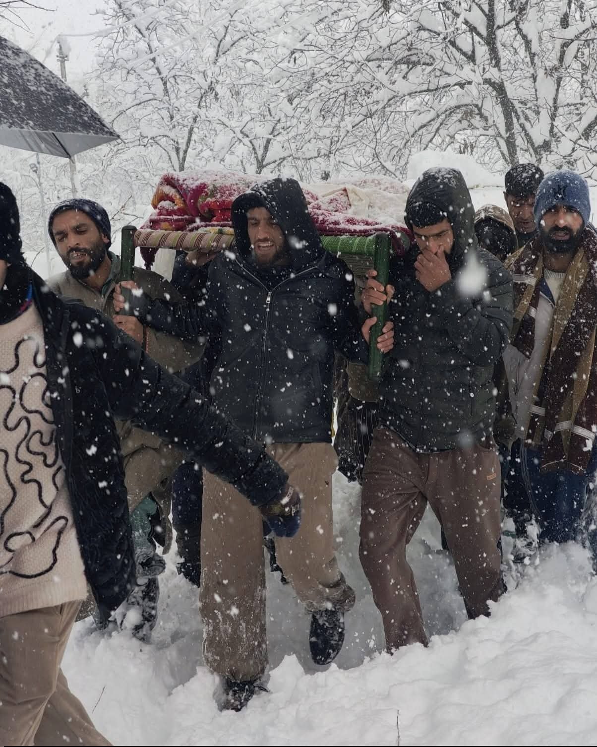 Handwara Police rescued a woman amid heavy snowfall in Sheenipora, 